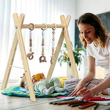 Load image into Gallery viewer, COSTWAY Baby Wooden Play Gym, Foldable Infants Gym Frame with Hanging Bar, 3 Teething Toys, Mobile Baby Exercise Activity Set for Newborn (Natural)